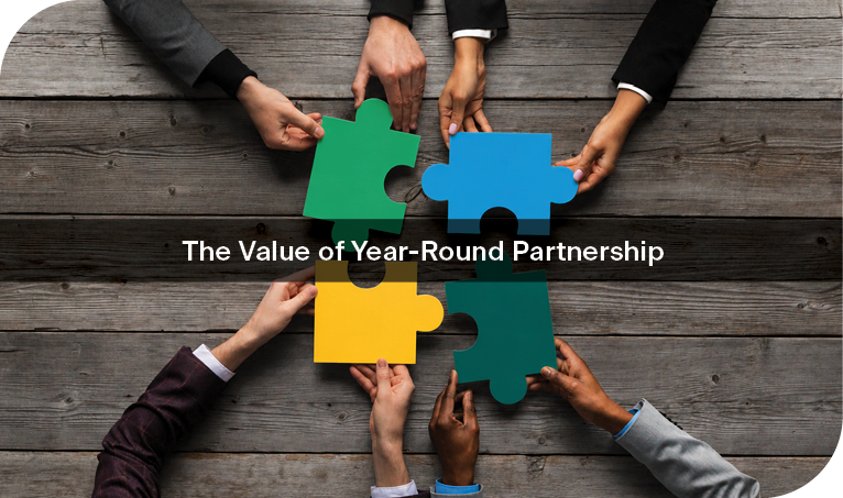 image of puzzle pieces with "the value of year round partnership" written overtop.