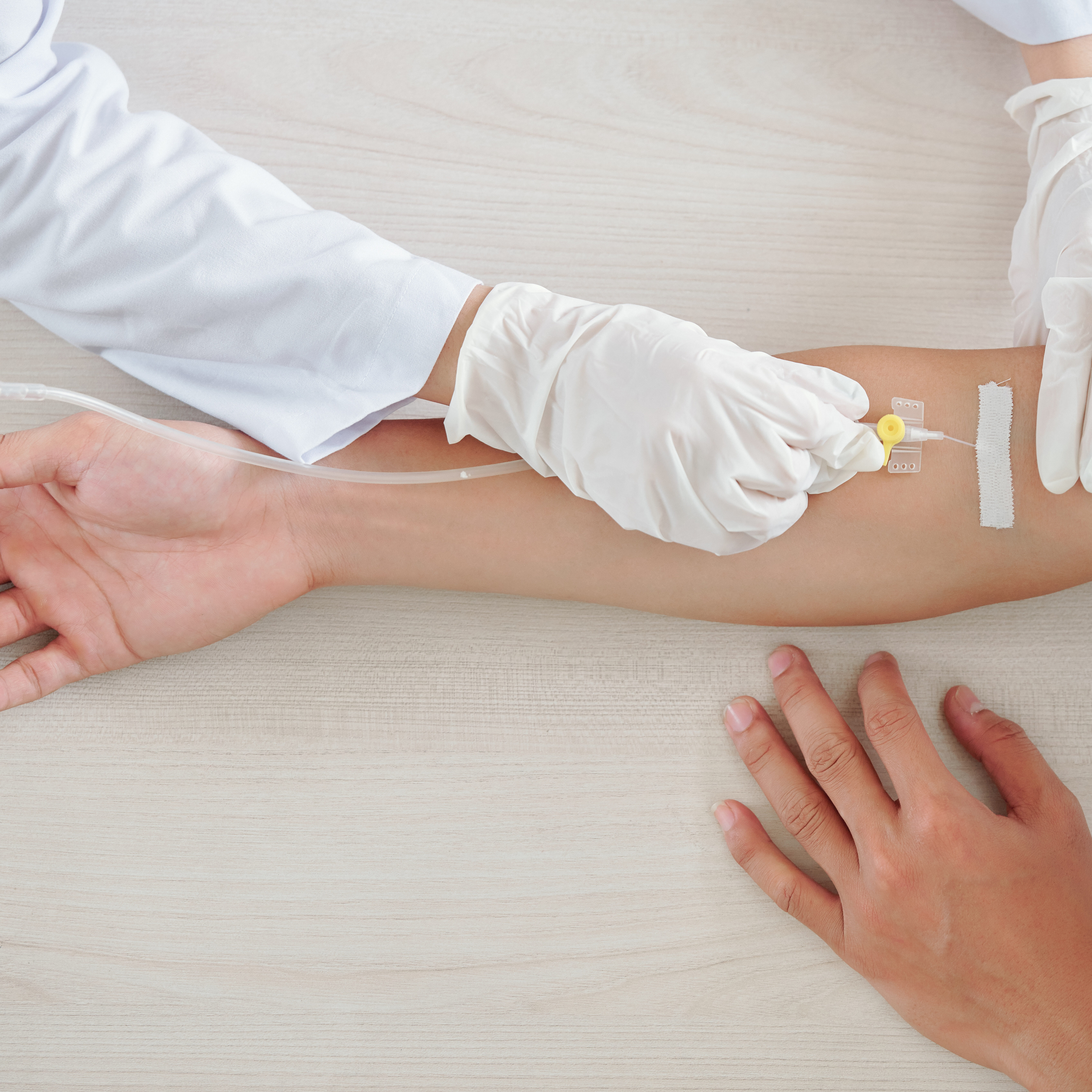 A medical provider administers specialty medications to a member through an IV
